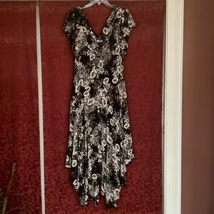 Black and white rose dress, form fitting.